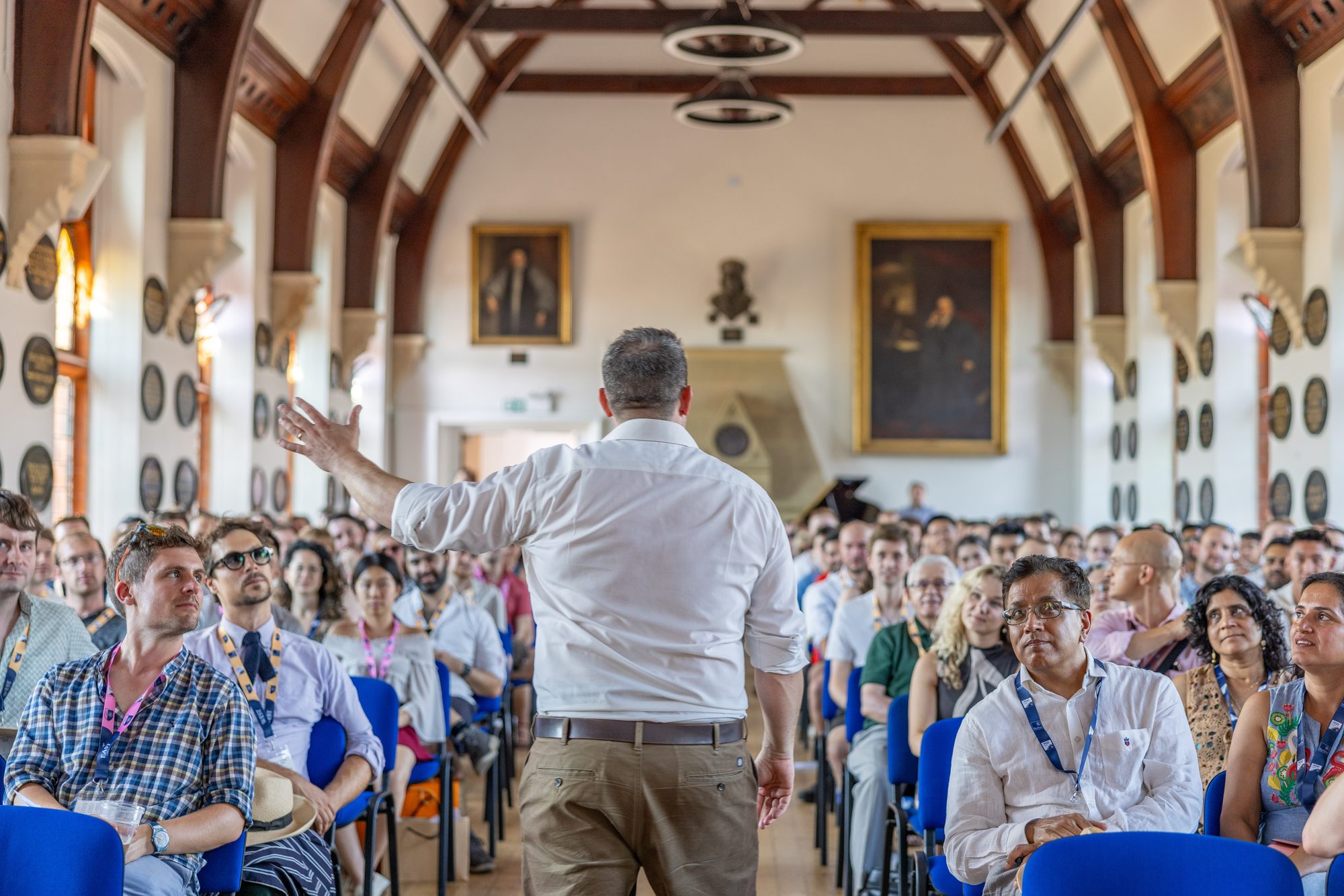 A speaker addressing a full audience in Big School